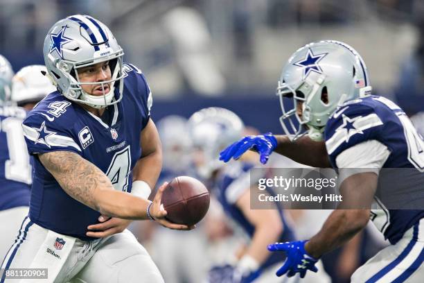 Dak Prescott hands off the ball to Alfred Morris of the Dallas Cowboys during a game against the Los Angeles Chargers at AT&T Stadium on November 23,...