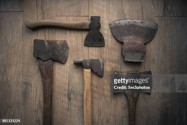 vintage axes overhead view on distressed wood background - axe stock pictures, royalty-free photos & images