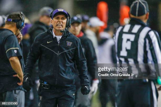 Head coach Chris Petersen of the Washington Huskies yells at field judge Kevin Kieser during the game against the Washington State Cougars at Husky...