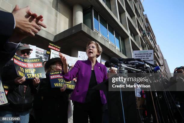 Sen. Elizabeth Warren speaks during a protest in front of the Consumer Financial Protection Bureau headquarters on November 28, 2017 in Washington,...