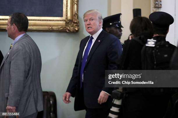 President Donald Trump leaves the weekly Senate Republican Policy Committee luncheon in the U.S. Capitol November 28, 2017 in Washington, DC....