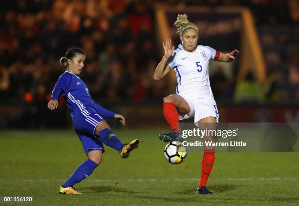 Steph Houghton of England and Saule Karibayeva of Kazakhstan during the FIFA Women's World Cup Qualifier between England and Kazakhstan at Weston...