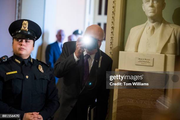 Sen. Patrick Leahy, D-Vt., takes a picture of the media set up for the arrival of President Donald Trump to the Republican Senate Policy luncheon in...