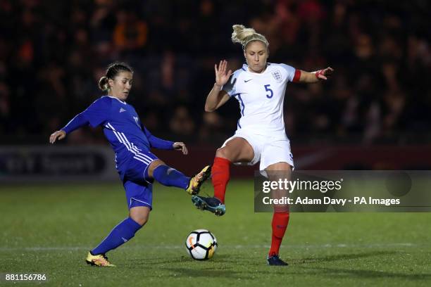 Kazakhstan;s Saule Karibayeva and England's Steph Houghton battle for the ball during the 2019 Women's World Cup Qualifying, Group One match at the...