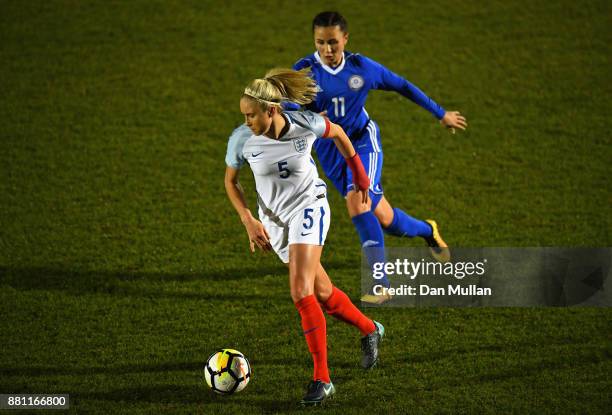 Steph Houghton of England evades Saule Karibayeva of Kazakhstan during the FIFA Women's World Cup Qualifier between England and Kazakhstan at Weston...