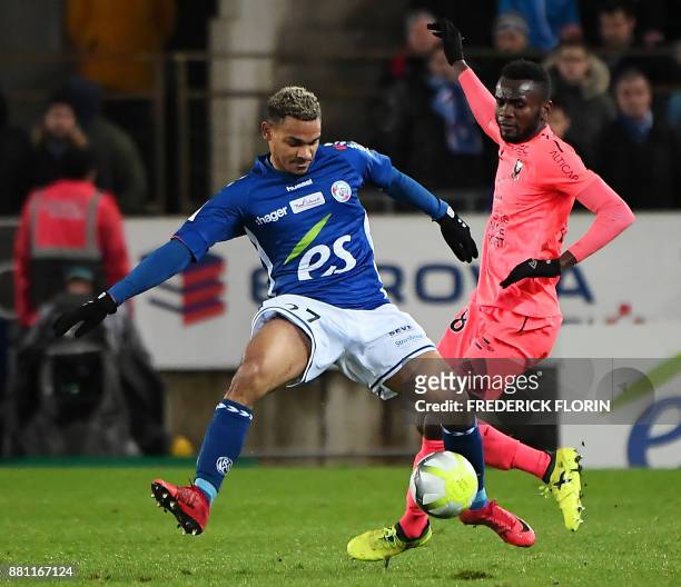 Caen's Belgian midfielder Stef Peeters vies with Strasbourg's French defender Kenny Lala during the French L1 football match between Strasbourg and...