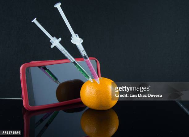 more and more people are using their mobile phones to watch genetic modification - genetic screening stock pictures, royalty-free photos & images
