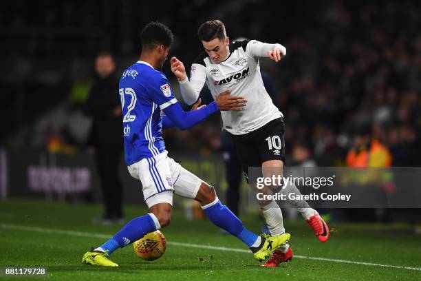 Tom Lawrence of Derby County battles for the ball with Jordan Spence of Ipswich Town during the Sky Bet Championship match between Derby County and...