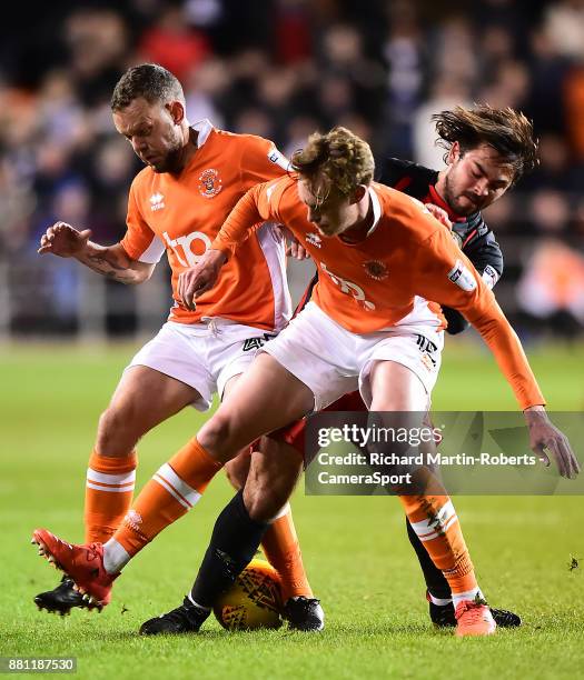 Blackburn Rovers' Bradley Dack competes with Blackpool's Jay Spearing and Sean Longstaff during the Sky Bet League One match between Blackpool and...