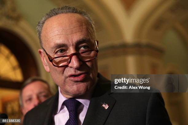 Senate Minority Leader Sen. Chuck Schumer speaks as Senate Minority Whip Sen. Dick Durbin looks on during a news briefing after a weekly Senate...