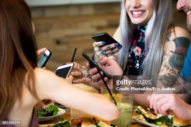 Friends all using smart phones