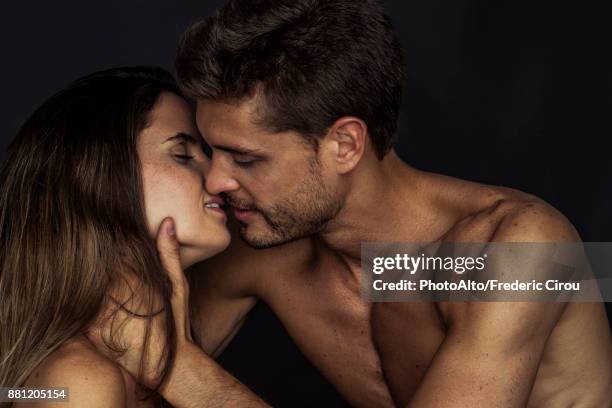 couple preparing to kiss - chest kissing stockfoto's en -beelden