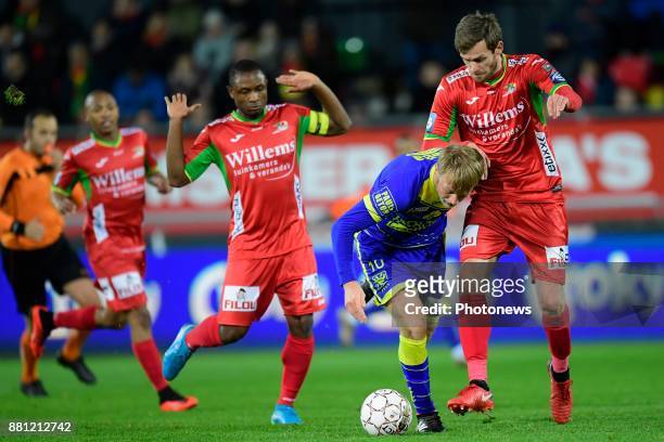 Roman Bezus midfielder of STVV is fighting for the ball with Nicolas Lombaerts defender of KV Oostende during the Croky Cup 1/8 final match between...