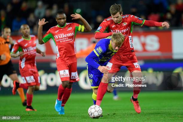 Roman Bezus midfielder of STVV is fighting for the ball with Nicolas Lombaerts defender of KV Oostende during the Croky Cup 1/8 final match between...
