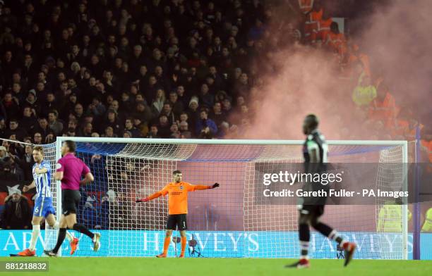 Crystal Palace fans let off smoke bombs in the stands during the Premier League match at the AMEX Stadium, Brighton.