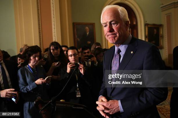 Senate Majority Whip Sen. John Cornyn pauses during a news briefing after a weekly Senate Republican Policy Luncheon at the Capitol November 28, 2017...