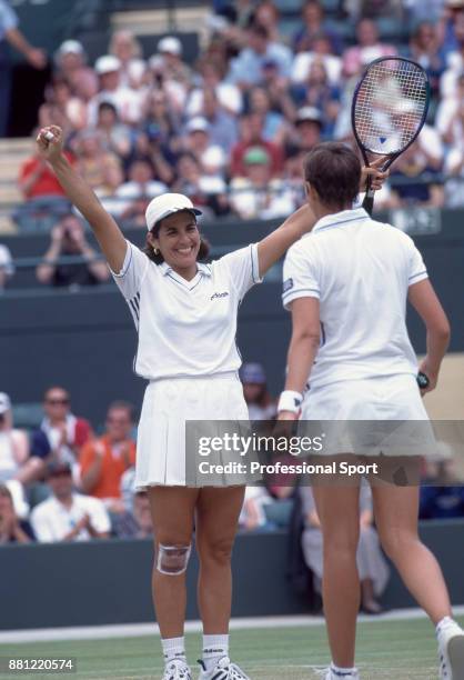 Doubles partners Gigi Fernandez of the USA and Natasha Zvereva of Belarus celebrate after defeating Nicole Arendt of the USA and Manon Bollegraf of...