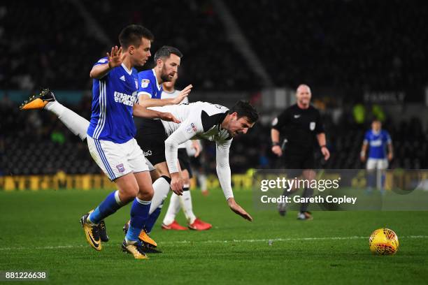 Jonas Knudsen of Ipswich Town battles for the ball with George Thorne of Derby County during the Sky Bet Championship match between Derby County and...