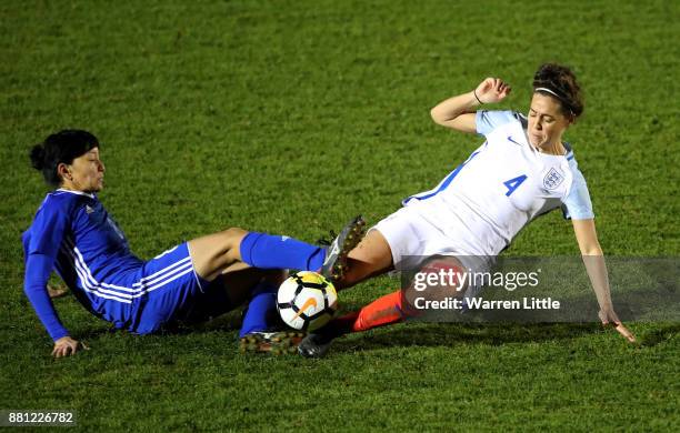 Fara Williams of England tackles Begaim Kirgizbaeva of Kazakhstan during the FIFA Women's World Cup Qualifier match between England and Kazakhstan at...