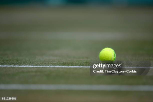 Tennis ball on a grass court during the Wimbledon Lawn Tennis Championships at the All England Lawn Tennis and Croquet Club at Wimbledon on July 10,...