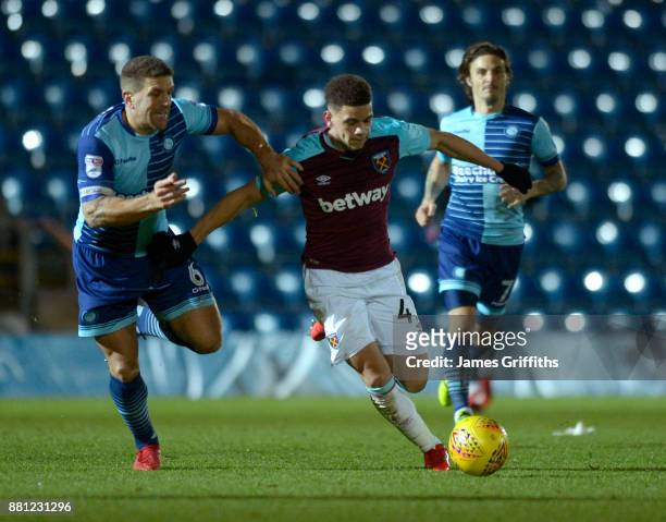 Marcus Browne of West Ham United in action with Adam El-Abd of Wycombe Wanderers during the Checkatrade Trophy match between Wycombe Wanderers and...