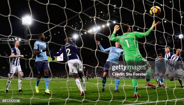 Newcastle captain Ciaran Clark heads in Newcastle's first goal during the Premier League match between West Bromwich Albion and Newcastle United at...