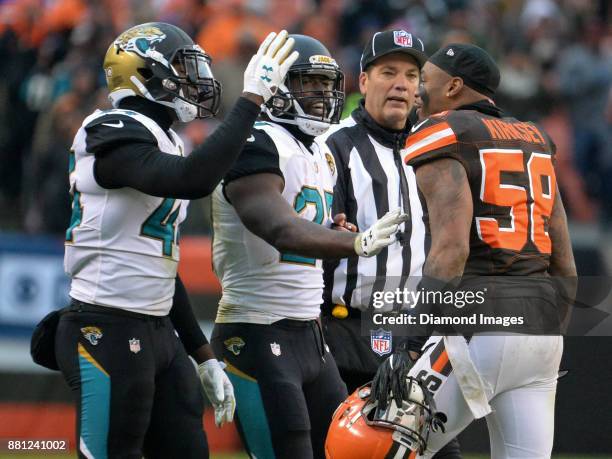 Linebacker Myles Jack and running back Leonard Fournette of the Jacksonville Jaguars taunt linebacker Christian Kirksey of the Cleveland Browns...