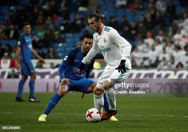 Gareth Bale of Real Madrid in action against Cristobal of Fuenlabrada during the King's Cup soccer match between Real Madrid and Fuenlabrada at...