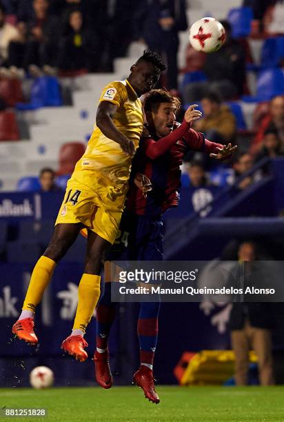 Jose Gomez Campana of Levante competes for the ball with Olunga Ogada of Girona during the Copa del Rey, Round of 32, Second Leg match between...