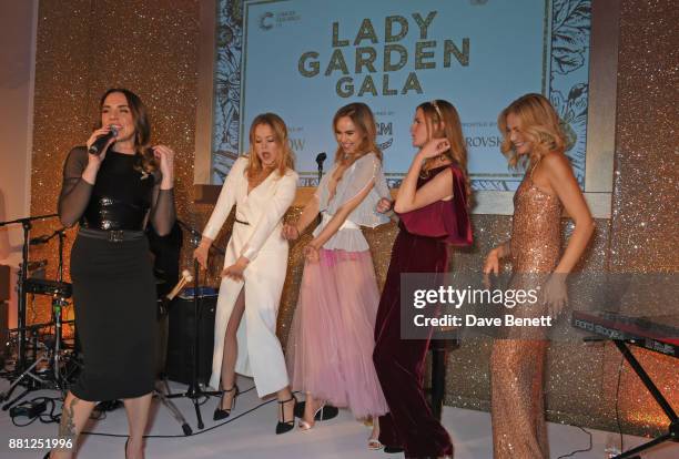 Melanie C performs as Poppy Jamie, Suki Waterhouse, Chloe Delevingne and Clara Paget sing back up at the Lady Garden Gala in aid of Silent No More...