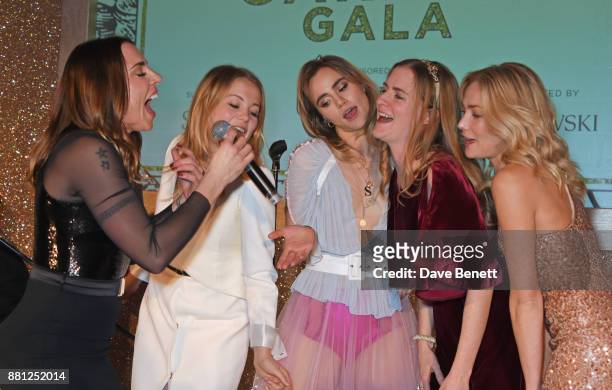 Melanie C performs as Poppy Jamie, Suki Waterhouse, Chloe Delevingne and Clara Paget sing back up at the Lady Garden Gala in aid of Silent No More...
