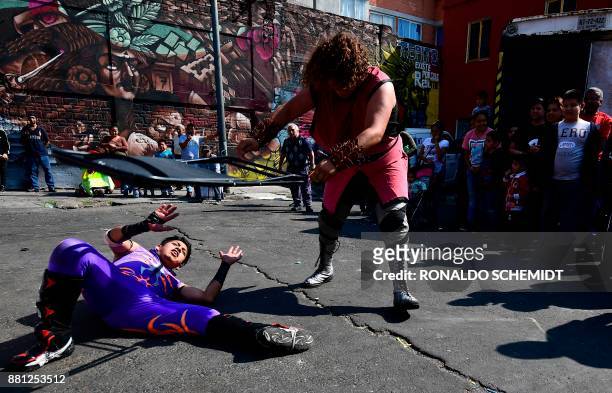 Mexican wrestlers participate in an open-air championship in the poor neighborhood of Tepito, on November 28, 2017. The heart of Tepito, one of the...
