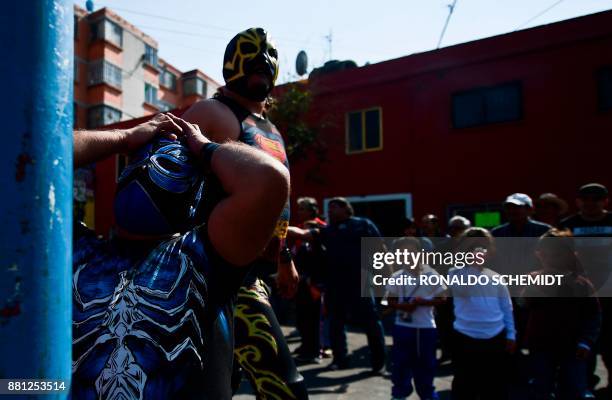 Mexican wrestlers participate in an open-air championship in the poor neighborhood of Tepito, on November 28, 2017. The heart of Tepito, one of the...