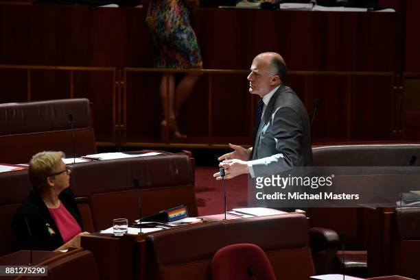 Senator Eric Abetz in discussion with Janet Rice durig the debate of the marriage equality bill in the Senate at Parliament House on November 29,...