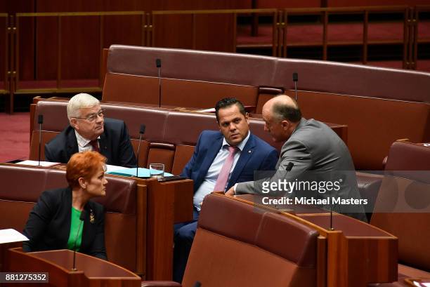Senators Pauline Hanson , Brian Burston , Peter Georgiou and Eric Abetz in discussion during the dabte of the marriage equality bill in the Senate at...