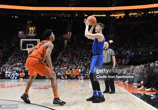 Duke guard Alex OConnell looks to pass against Florida guard Jalen Hudson in the championship game of the Motion Bracket at the PK80-Phil Knight...