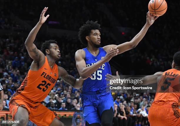 Duke forward Marvin Bagley III passes the ball against Florida forward Keith Stone in the championship game of the Motion Bracket at the PK80-Phil...