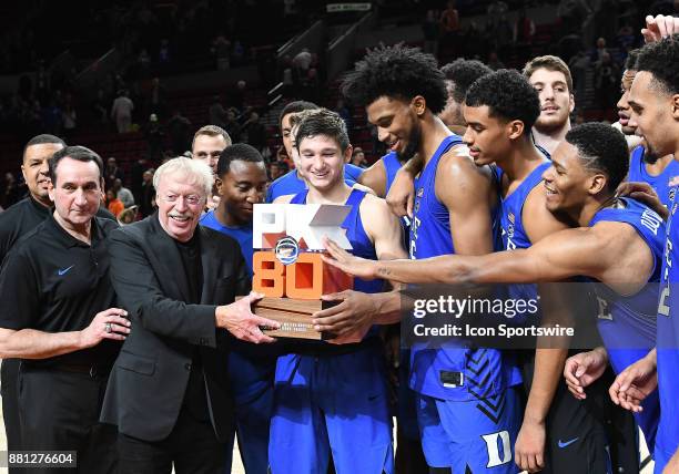 Nike chairman and co-founder Phil Knight presents the Duke Blue Devils with the Motion Bracket championship trophy at the PK80-Phil Knight...