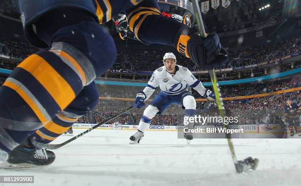 Cedric Paquette of the Tampa Bay Lightning closes in on the puck during the second period of an NHL game against the Buffalo Sabres on November 28,...