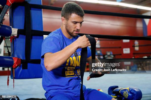 Vasyl Lomachenko wraps his hands during a media workout at the Boxing Laboratory on November 28, 2017 in Oxnard, California.