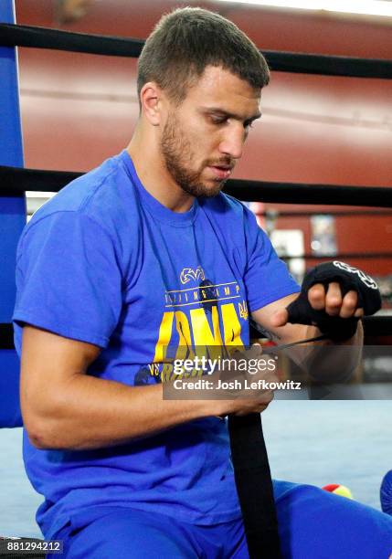 Vasyl Lomachenko wraps his hands during a media workout at the Boxing Laboratory on November 28, 2017 in Oxnard, California.