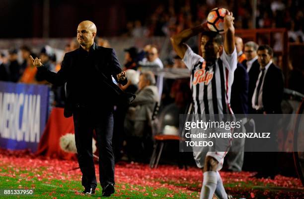 Paraguay's Libertad team coach Fernando Carmona gestures during their Copa Sudamericana second leg semifinal football match against Argentina's...