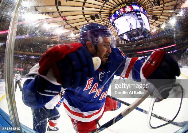 Kevin Shattenkirk of the New York Rangers is checked during their game against the Florida Panthers at Madison Square Garden on November 28, 2017 in...