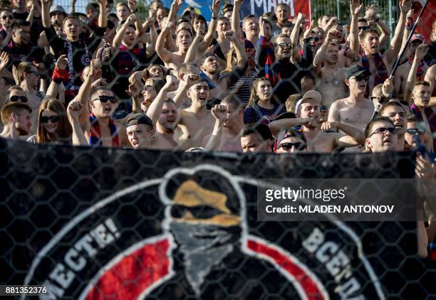 Picture taken on August 19, 2017 shows supporters of Moscow's CSKA shouting slogans during the Russian Premier League football match CSKA Moscow vs...