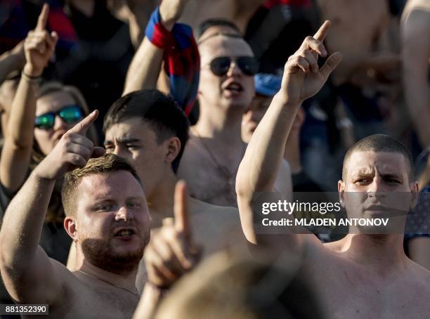 Picture taken on August 19, 2017 shows supporters of Moscow's CSKA shouting slogans during the Russian Premier League football match CSKA Moscow vs...