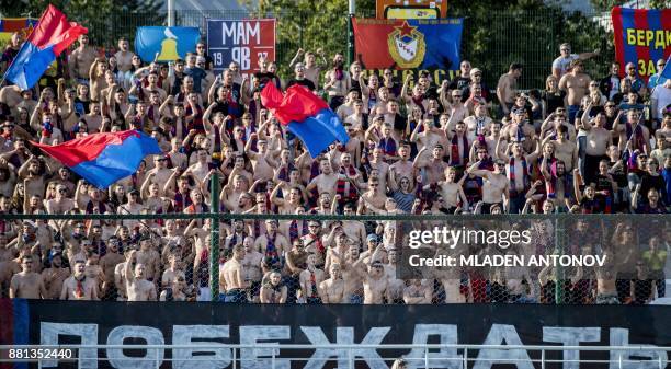 Picture taken on August 19, 2017 shows supporters of Moscow's CSKA shouting slogans during the Russian Premier League football match CSKA Moscow vs...