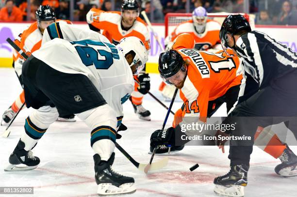 Philadelphia Flyers center Sean Couturier and San Jose Sharks right wing Joel Ward face off during the NHL game between the San Jose Sharks and the...