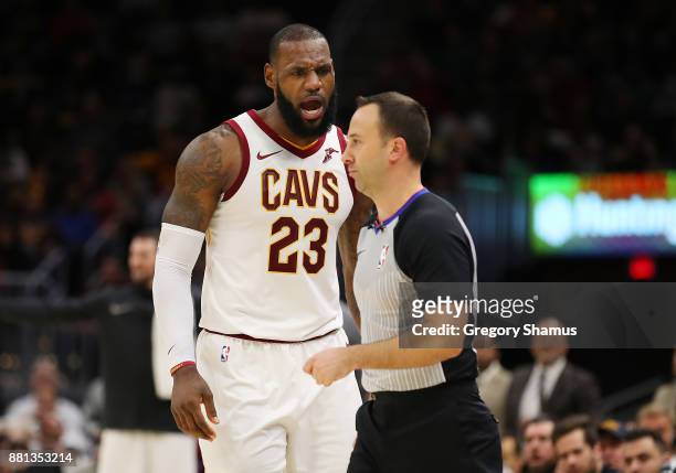 LeBron James of the Cleveland Cavaliers argues after being ejected in the second half by referee Kane Fitzgerald while playing the Miami Heat at...