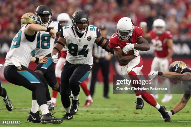 Running back Kerwynn Williams of the Arizona Cardinals rushes the football against the Jacksonville Jaguars during the first half of the NFL game at...
