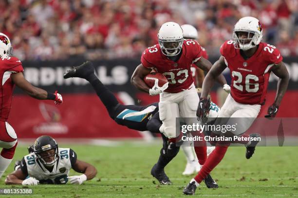 Running back Kerwynn Williams of the Arizona Cardinals rushes the football against the Jacksonville Jaguars during the first half of the NFL game at...